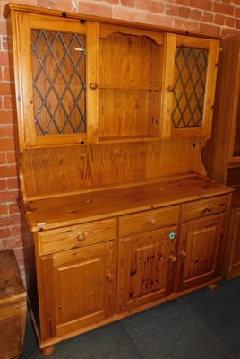 Lot 1003 - A pine dresser, with two glazed and leaded...