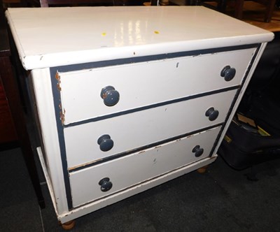 Lot 1002 - A painted pine chest of three long drawers,...