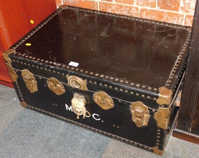 Lot 1006 - A black metal travelling trunk,...