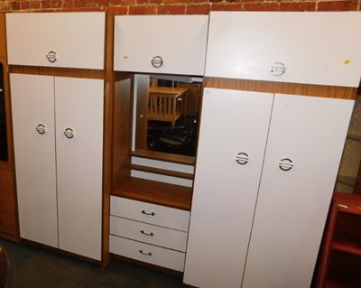 Lot 1021 - A formica finished bedroom wardrobe unit, with...