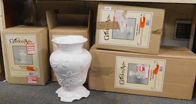 Lot 2008 - Four white ceramic vases, with foliate motifs,...