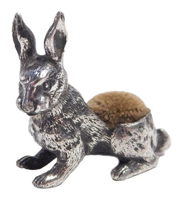 Lot 684 - A silver-plated pin cushion, modelled as a...