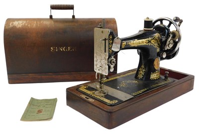 Lot 758 - A Singer hand operated cased sewing machine,...