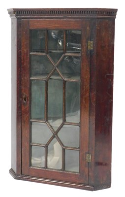 Lot 794 - A 19thC oak hanging corner cabinet, the top...