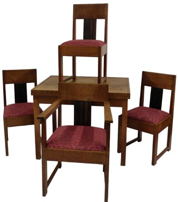 Lot 810 - An early 20thC oak dining suite, possibly...