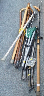 Lot 2078 - A group of walking sticks, fishing rods, etc....
