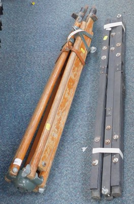 Lot 2080 - A large surveyor's tripod, and a metal frame.