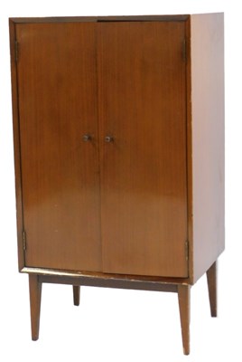 Lot 845 - A mid century teak music cabinet, with two...