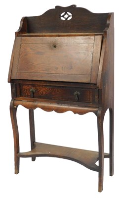 Lot 852 - An early 20thC oak student's bureau, with a...