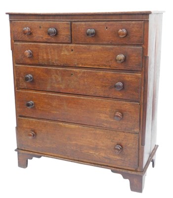 Lot 853 - A Georgian oak chest, of two short over four...