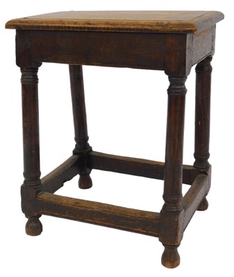 Lot 855 - An 18thC elm stool, the rectangular top raised...
