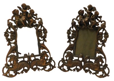 Lot 741a - A pair of cast metal frames, decorated with...