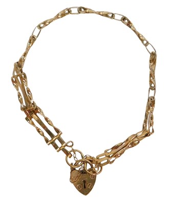 Lot 773 - A 9ct gold three bar gate bracelet, on a heart...