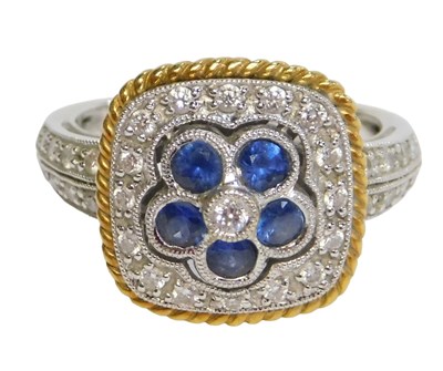 Lot 775A - An 18ct white gold sapphire and diamond flower...
