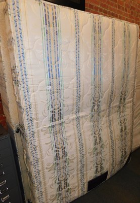 Lot 1057 - A double mattress, together with bed base.