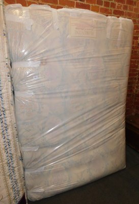 Lot 1058 - A double mattress, together with bed base.