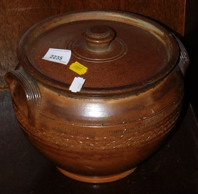 Lot 2235 - A stoneware twin handled jar and cover.
