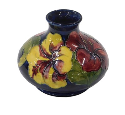 Lot 21 - A Moorcroft Clematis squat vase, on a dark...