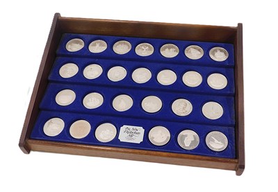 Lot 38 - A Royal Mint New Elizabethan Age silver coin...