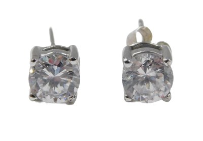 Lot 76 - A pair of 9ct white gold stud earrings, each...